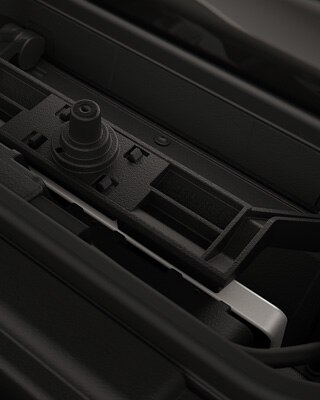 Integrated charging compartment with mobile phone.
